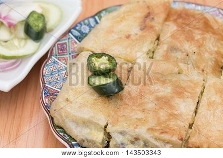 Martabak or murtabak is a stuffed pancake is arab food.