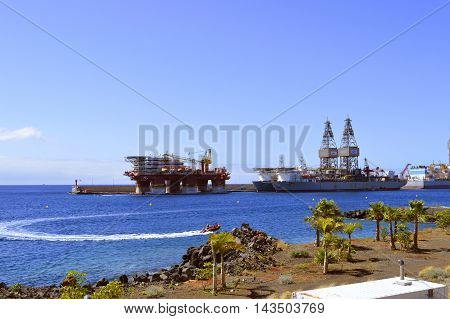 Santa Cruz De Tenerife port Tenerife Canary Islands Spain Europe - June 14 2016 : Ensco offshore drilling ships and Floatel Reliance platform in Santa Cruz De Tenerife port
