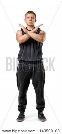 Full body portrait of handsome muscled young man making X sign with his arms isolated on white background. Fitness, sport, bodybuilding, workout. Body language. Prohibitions and restrictions.