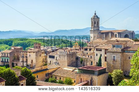 The medieval quarter of Gerona with bell tower of Santa Maria cathedral in background. View from The Forca Vella. Gerona Costa Brava Catalonia Spain.