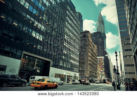NEW YORK CITY - FEB 19: Street view with skyscrapers on February 19, 2014 in Manhattan, New York City. With population of 8.4M, it is the most populous city in the United States.  