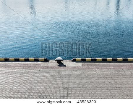 Textured Background Of Sea Water And A Pier In The City Seaport
