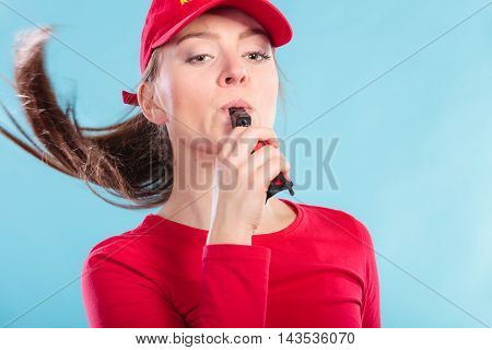 Lifeguard Woman In Cap On Duty Blowing Whistle.