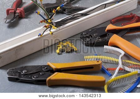Set of electrical tool on wooden background. Accessories for engineering work, energy concept