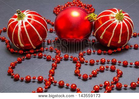 Christmas Red And Blue Balls With Bead On Black Background.