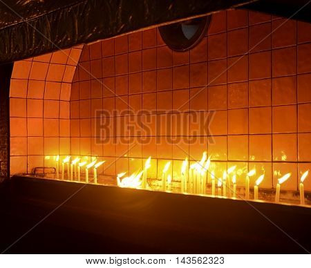 Candles in Church Worship. A votive candle or prayer candle is