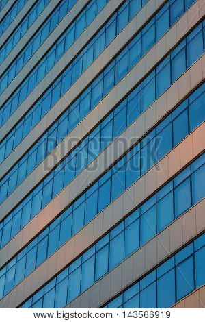 Exterior of Glass Business Building on a Clear Sky Background