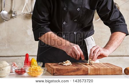 Restuarant Hotel Private Chef Cutting Mushrooms On Board