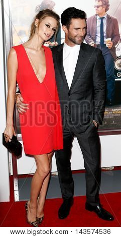 NEW YORK-JUNE 25: Behati Prinsloo (L) and Adam Levine attend the New York premiere of 