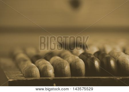 Old wooden abacus on the wooden table