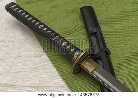 Japanese traditional samurai damask sword on the background