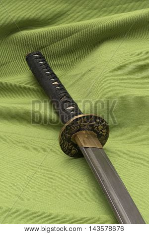 Japanese traditional samurai damask sword on the background