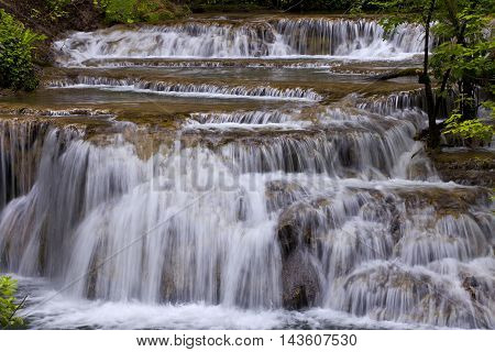 beautiful waterfalls with autumn leaves after fulling