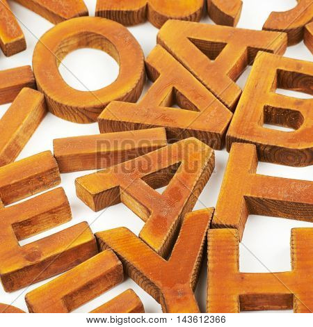 Surface coated with the multiple painted wooden block letters as an abstract backrop composition