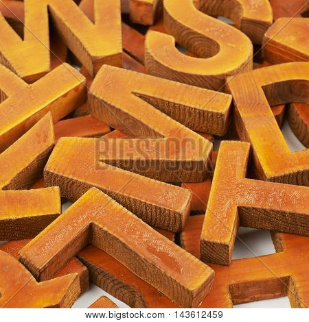 Surface coated with the multiple painted wooden block letters as an abstract backrop composition