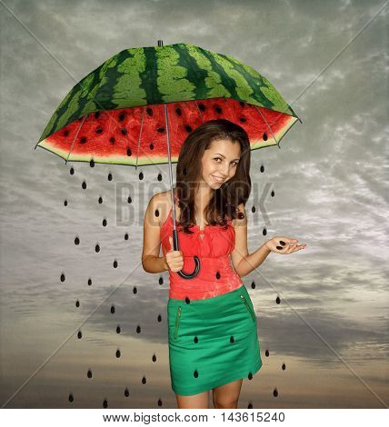 The girl with an umbrella. Season watermelons.