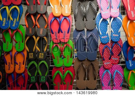 BANGKOK, THAILAND - AUGUST, 2016 - Colorful slippers are displayed on trellises for sale in Jatujak weekend market. Jatujak market is the largest flea market in the world located in Bangkok, Thailand.