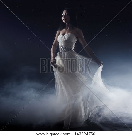 Portrait of girl in long white dress, mystical, mysterious style, dark background