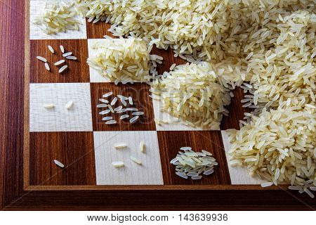 chessboard with exponential growing heaps of rice grains concept of unlimited growth
