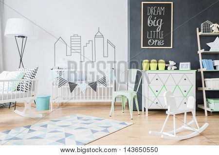 Modern design of comfortable spacious baby room