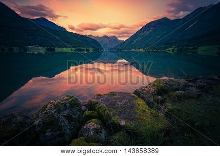 Norway Glacier Lake Sunset. Oppstrynsvatnet Norway Oppstryn Lake Reflections Scenery.