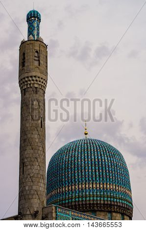 Color photo of old mosque in Saint-Petersburg on the background of the grey sky