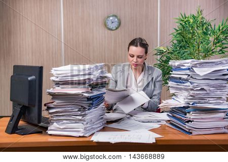 Businesswoman under stress working in the office