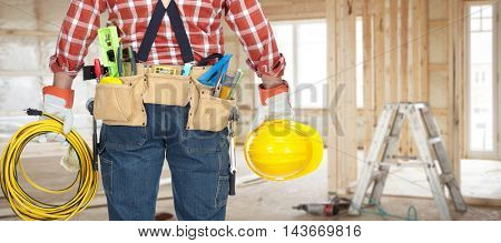 Electrician with helmet and cable.