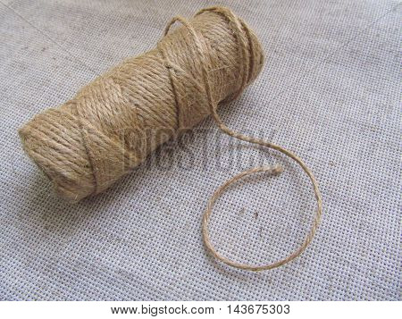 Organic jute thread hank on linen background