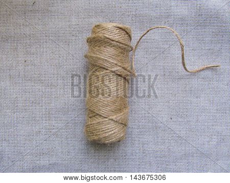 Natural jute thread hank on linen background