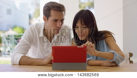 Man and woman using a tablet computer together