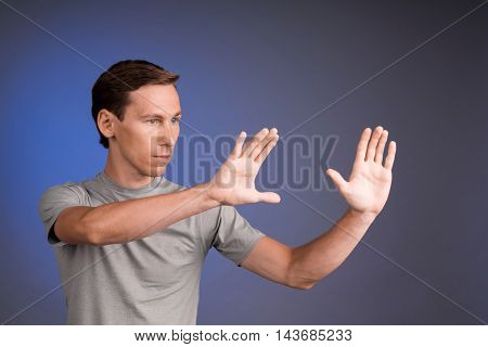 Man working with virtual touch screen.