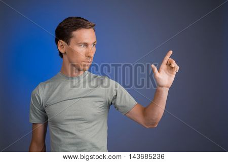 Man working with virtual touch screen.