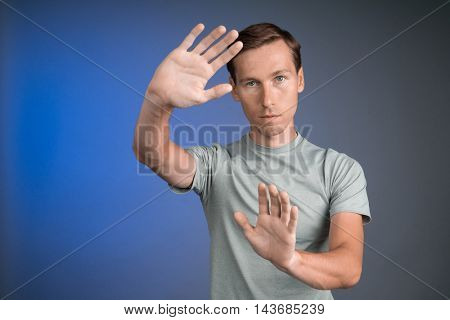 Man working with virtual touch screen.