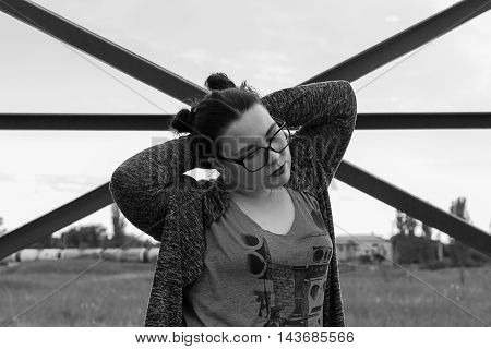 Black and white photo. Plus size model. Intersection. Woman in glasses