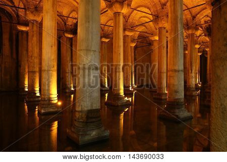 ISTANBUL TURKEY - JULY 28 2016: Columns and water inside Basilica Cistern. The Basilica Cistern is the largest of several hundred ancient cisterns that lie beneath the city of Istanbul.