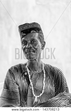 KARA, TOGO - MAR 9, 2013: Unidentified Togolese man in the traditional clothes. People in Togo suffer of poverty due to the unstable econimic situation