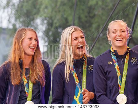 STOCKHOLM SWEDEN - AUG 21 2016: Happy swedish female soccer team when the swedish olympic athletes are celebrated in Kungstradgarden Stockholm Sweden August 212016