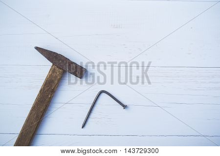 Set of old and rusty hammers on blue background