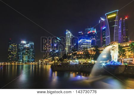 SINGAPORE SINGAPORE - SEPTEMBER 28 2013 : Night view of The Merlion located at Marina Bay a famous tourist attractions in Singapore.