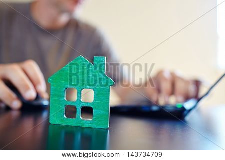 wooden house on the office table