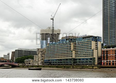 LONDON ENGLAND - JULY 8 2016: Sea Containers House - an eclectic farm-to-table fare in the Mondrian Hotel's chic eatery with some outdoor riverside tables.