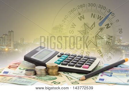 Calculator with coin pencil on money banknotes Euro and Dollarsconcept of business planning and finance and savings