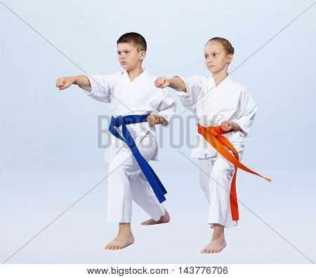 Boy and girl athletes beat punch arm