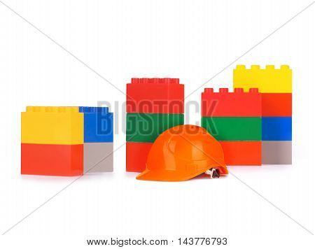 toy building blocks with helmet on white