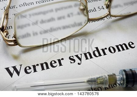 Paper with words Werner syndrome and glasses. Medical concept.