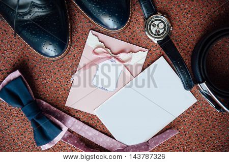 Set of groom clothes. Wedding rings shoes cufflinks and bow tie detalis fashion. place for your text