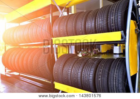 Tire rubber products , Group of new tires for sale at a tire store.