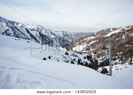The cable car in the snowy mountains Chimbulak photo for you