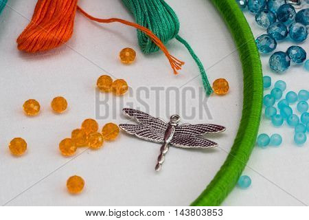 set for making a Dreamcatcher beads thread on a white background